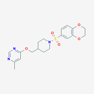 molecular formula C19H23N3O5S B2616619 4-((1-((2,3-Dihydrobenzo[b][1,4]dioxin-6-yl)sulfonyl)piperidin-4-yl)methoxy)-6-methylpyrimidine CAS No. 2320824-07-3