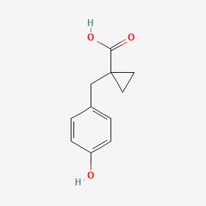 1-[(4-Hydroxyphenyl)methyl]cyclopropane-1-carboxylic acid