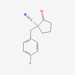 1-[(4-Fluorophenyl)methyl]-2-oxocyclopentane-1-carbonitrile