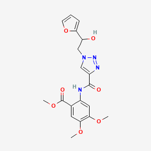 molecular formula C19H20N4O7 B2619664 methyl 2-(1-(2-(furan-2-yl)-2-hydroxyethyl)-1H-1,2,3-triazole-4-carboxamido)-4,5-dimethoxybenzoate CAS No. 2034534-70-6