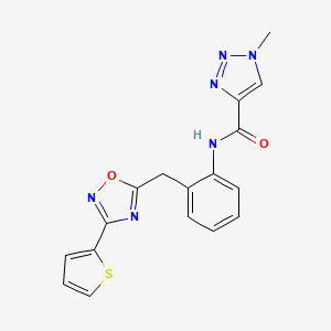 molecular formula C17H14N6O2S B2625038 1-methyl-N-(2-((3-(thiophen-2-yl)-1,2,4-oxadiazol-5-yl)methyl)phenyl)-1H-1,2,3-triazole-4-carboxamide CAS No. 1797077-07-6