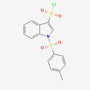 molecular formula C15H12ClNO4S2 B2629206 1-甲苯磺酰基-1H-吲哚-3-磺酰氯 CAS No. 881406-30-0