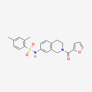 molecular formula C22H22N2O4S B2639543 N-(2-(呋喃-2-羰基)-1,2,3,4-四氢异喹啉-7-基)-2,4-二甲苯磺酰胺 CAS No. 955698-16-5