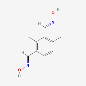 molecular formula C11H14N2O2 B2642255 (NE)-N-[[3-[(E)-hydroxyiminomethyl]-2,4,6-trimethylphenyl]methylidene]hydroxylamine CAS No. 15138-40-6