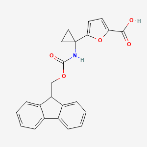 molecular formula C23H19NO5 B2643249 5-[1-(9H-Fluoren-9-ylmethoxycarbonylamino)cyclopropyl]furan-2-carboxylic acid CAS No. 2580217-36-1