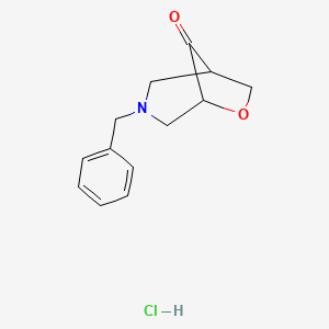 molecular formula C13H16ClNO2 B2645604 3-苄基-6-氧杂-3-氮杂双环[3.2.1]辛烷-8-酮；盐酸盐 CAS No. 2344685-54-5
