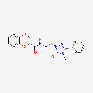 molecular formula C19H19N5O4 B2647316 N-(2-(4-methyl-5-oxo-3-(pyridin-2-yl)-4,5-dihydro-1H-1,2,4-triazol-1-yl)ethyl)-2,3-dihydrobenzo[b][1,4]dioxine-2-carboxamide CAS No. 1210359-49-1