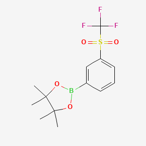 molecular formula C13H16BF3O4S B2648134 4,4,5,5-Tetramethyl-2-(3-trifluoromethanesulfonylphenyl)-1,3,2-dioxaborolane CAS No. 1356944-00-7