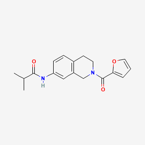 molecular formula C18H20N2O3 B2648400 N-(2-(furan-2-carbonyl)-1,2,3,4-tetrahydroisoquinolin-7-yl)isobutyramide CAS No. 955686-33-6