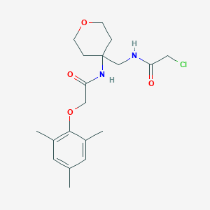 molecular formula C19H27ClN2O4 B2650264 N-[4-[[(2-Chloroacetyl)amino]methyl]oxan-4-yl]-2-(2,4,6-trimethylphenoxy)acetamide CAS No. 2418680-32-5