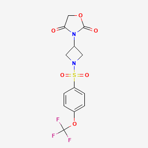 molecular formula C13H11F3N2O6S B2653013 3-(1-((4-(三氟甲氧基)苯基)磺酰)氮杂环丁-3-基)恶唑烷-2,4-二酮 CAS No. 2034382-99-3