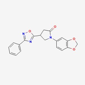 molecular formula C19H15N3O4 B2653432 1-(苯并[d][1,3]二氧杂环-5-基)-4-(3-苯基-1,2,4-恶二唑-5-基)吡咯烷-2-酮 CAS No. 946254-38-2