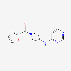 molecular formula C12H12N4O2 B2653597 N-[1-(furan-2-carbonyl)azetidin-3-yl]pyrimidin-4-amine CAS No. 2097899-51-7