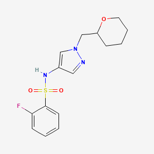 molecular formula C15H18FN3O3S B2661909 2-氟代-N-(1-[(四氢呋喃-2-基)甲基]-1H-吡唑-4-基)苯磺酰胺 CAS No. 2034613-14-2