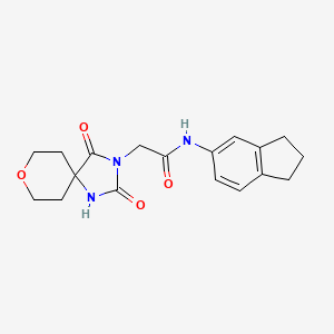 molecular formula C18H21N3O4 B2666583 N-(2,3-二氢-1H-茚-5-基)-2-(2,4-二氧代-8-氧代-1,3-二氮杂螺[4.5]癸-3-基)乙酰胺 CAS No. 1775334-58-1