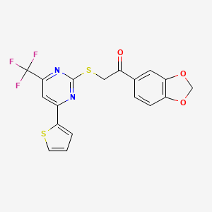 molecular formula C18H11F3N2O3S2 B2667137 1-(1,3-苯并二氧杂环-5-基)-2-{[4-(噻吩-2-基)-6-(三氟甲基)嘧啶-2-基]磺酰基}乙酮 CAS No. 940984-35-0
