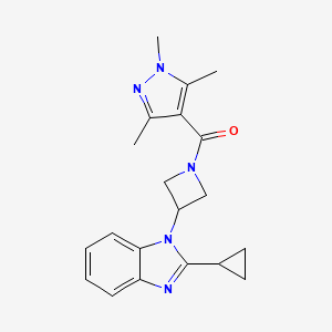 molecular formula C20H23N5O B2667680 [3-(2-Cyclopropylbenzimidazol-1-yl)azetidin-1-yl]-(1,3,5-trimethylpyrazol-4-yl)methanone CAS No. 2379971-14-7