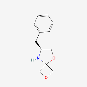 molecular formula C12H15NO2 B2671471 (S)-7-苄基-2,5-二氧杂-8-氮杂螺[3.4]辛烷 CAS No. 1556097-30-3