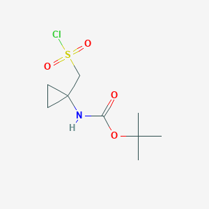 molecular formula C9H16ClNO4S B2672225 Tert-butyl N-[1-(chlorosulfonylmethyl)cyclopropyl]carbamate CAS No. 2166949-71-7