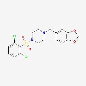 molecular formula C18H18Cl2N2O4S B2674936 1-(1,3-Benzodioxol-5-ylmethyl)-4-(2,6-dichlorophenyl)sulfonylpiperazine CAS No. 670272-27-2