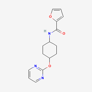 molecular formula C15H17N3O3 B2675708 N-((1r,4r)-4-(嘧啶-2-氧基)环己基)呋喃-2-甲酰胺 CAS No. 2034581-25-2