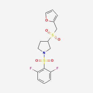 molecular formula C15H15F2NO5S2 B2677303 1-((2,6-Difluorophenyl)sulfonyl)-3-((furan-2-ylmethyl)sulfonyl)pyrrolidine CAS No. 1798674-92-6