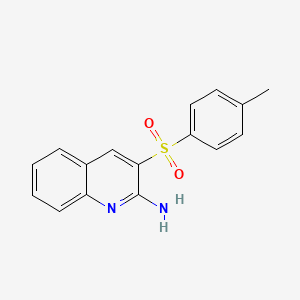 3-[(4-Methylphenyl)sulfonyl]-2-quinolinylamine