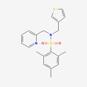 2,4,6-trimethyl-N-(pyridin-2-ylmethyl)-N-(thiophen-3-ylmethyl)benzenesulfonamide