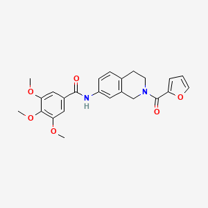 B2690232 N-(2-(furan-2-carbonyl)-1,2,3,4-tetrahydroisoquinolin-7-yl)-3,4,5-trimethoxybenzamide CAS No. 955684-13-6