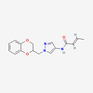 (E)-N-(1-((2,3-dihydrobenzo[b][1,4]dioxin-2-yl)methyl)-1H-pyrazol-4-yl)but-2-enamide