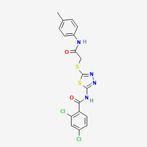 molecular formula C18H14Cl2N4O2S2 B2696576 2,4-dichloro-N-(5-((2-oxo-2-(p-tolylamino)ethyl)thio)-1,3,4-thiadiazol-2-yl)benzamide CAS No. 392291-72-4