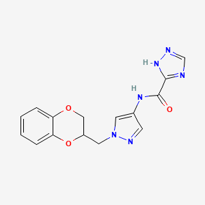 molecular formula C15H14N6O3 B2700849 N-(1-((2,3-二氢苯并[b][1,4]二氧杂环己烷-2-基)甲基)-1H-吡唑-4-基)-1H-1,2,4-三唑-5-羧酰胺 CAS No. 1705845-02-8