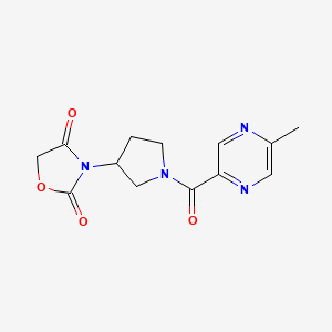 molecular formula C13H14N4O4 B2703894 3-(1-(5-Methylpyrazine-2-carbonyl)pyrrolidin-3-yl)oxazolidine-2,4-dione CAS No. 2034297-72-6