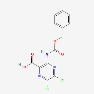 molecular formula C13H9Cl2N3O4 B2704306 5,6-Dichloro-3-(phenylmethoxycarbonylamino)pyrazine-2-carboxylic acid CAS No. 2287313-14-6