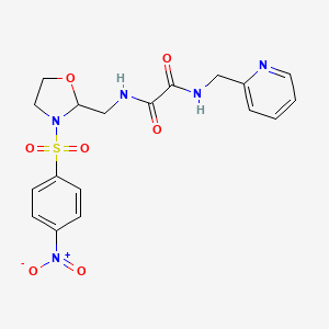 molecular formula C18H19N5O7S B2705545 N-[[3-(4-nitrophenyl)sulfonyl-2-oxazolidinyl]methyl]-N'-(2-pyridinylmethyl)oxamide CAS No. 868982-09-6