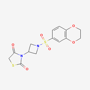 molecular formula C14H14N2O6S2 B2705922 3-(1-((2,3-二氢苯并[b][1,4]二氧杂-6-基)磺酰)氮杂环丁烷-3-基)噻唑烷-2,4-二酮 CAS No. 1795423-08-3