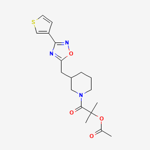 molecular formula C18H23N3O4S B2706249 2-Methyl-1-oxo-1-(3-((3-(thiophen-3-yl)-1,2,4-oxadiazol-5-yl)methyl)piperidin-1-yl)propan-2-yl acetate CAS No. 1795088-91-3