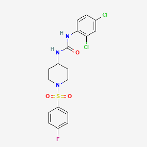molecular formula C18H18Cl2FN3O3S B2710563 N-(2,4-dichlorophenyl)-N'-{1-[(4-fluorophenyl)sulfonyl]-4-piperidinyl}urea CAS No. 866039-16-9