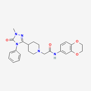 molecular formula C24H27N5O4 B2710579 N-(2,3-dihydrobenzo[b][1,4]dioxin-6-yl)-2-(4-(1-methyl-5-oxo-4-phenyl-4,5-dihydro-1H-1,2,4-triazol-3-yl)piperidin-1-yl)acetamide CAS No. 1396759-39-9
