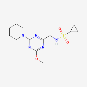 molecular formula C13H21N5O3S B2711794 N-((4-methoxy-6-(piperidin-1-yl)-1,3,5-triazin-2-yl)methyl)cyclopropanesulfonamide CAS No. 2034578-27-1