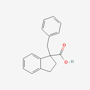 B2712205 1-benzyl-2,3-dihydro-1H-indene-1-carboxylic acid CAS No. 872785-39-2