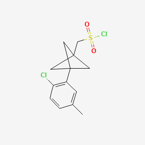 molecular formula C13H14Cl2O2S B2714706 [3-(2-Chloro-5-methylphenyl)-1-bicyclo[1.1.1]pentanyl]methanesulfonyl chloride CAS No. 2287343-47-7
