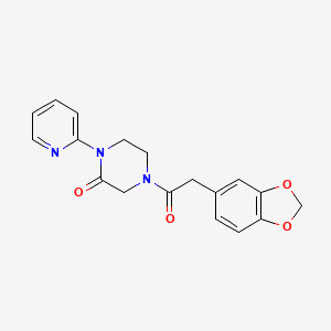 molecular formula C18H17N3O4 B2715111 4-[2-(1,3-Benzodioxol-5-yl)acetyl]-1-pyridin-2-ylpiperazin-2-one CAS No. 2309348-12-5