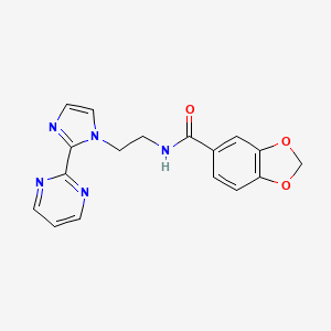 molecular formula C17H15N5O3 B2719722 N-(2-(2-(pyrimidin-2-yl)-1H-imidazol-1-yl)ethyl)benzo[d][1,3]dioxole-5-carboxamide CAS No. 1448122-11-9