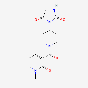 molecular formula C15H18N4O4 B2726792 3-(1-(1-Methyl-2-oxo-1,2-dihydropyridine-3-carbonyl)piperidin-4-yl)imidazolidine-2,4-dione CAS No. 2034311-89-0