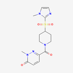 molecular formula C15H19N5O4S B2728140 2-methyl-6-(4-((1-methyl-1H-imidazol-2-yl)sulfonyl)piperidine-1-carbonyl)pyridazin-3(2H)-one CAS No. 2320173-75-7