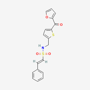 molecular formula C18H15NO4S2 B2737824 (E)-N-((5-(furan-2-carbonyl)thiophen-2-yl)methyl)-2-phenylethenesulfonamide CAS No. 1798405-57-8