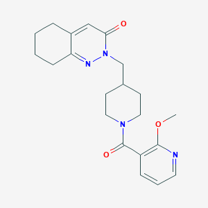 B2739887 2-[[1-(2-Methoxypyridine-3-carbonyl)piperidin-4-yl]methyl]-5,6,7,8-tetrahydrocinnolin-3-one CAS No. 2310158-07-5