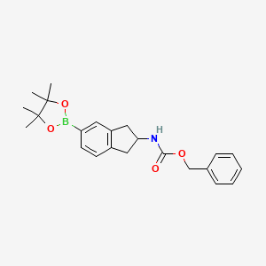 molecular formula C23H28BNO4 B2746837 Benzyl N-[5-(tetramethyl-1,3,2-dioxaborolan-2-yl)-2,3-dihydro-1H-inden-2-yl]carbamate CAS No. 2377587-35-2