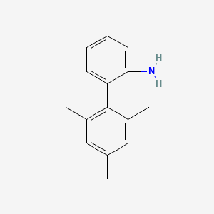 molecular formula C15H17N B2747649 2-(2,4,6-三甲基苯基)苯胺 CAS No. 25627-20-7